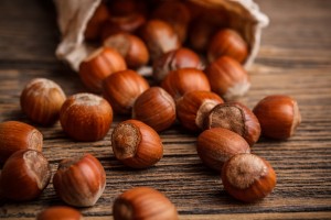 Close up of hazelnuts on the wooden texture